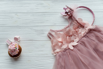 Fashion female child's dress isolated on white background for spring and summer wardrobe. Flat lay child's girl clothes. Copy spase