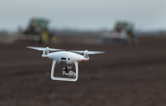 Drone flying above farmland