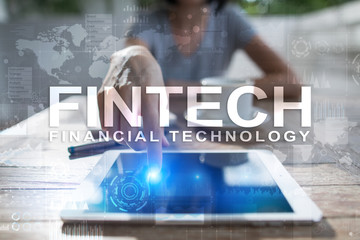 Fototapeta na wymiar Fintech. Financial technology text on virtual screen. Business, internet and technology concept.