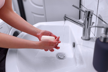 Cleaning hands. Soap in hands for cleaning. Hand hygiene..