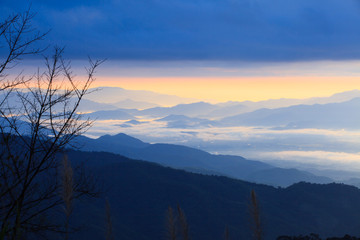 Scenery of mountain range in the morning mist.