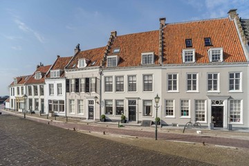 Fototapeta na wymiar Pleasing row of medieval plastered houses in Wijk bij Duurstede near Utrecht, the Netherlands.