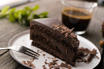 chocolate cake on wood background.