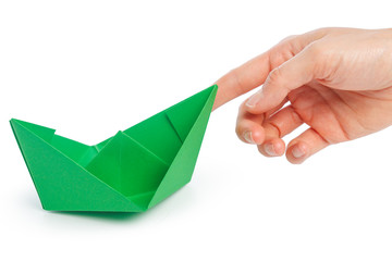Paper ship in a female hand