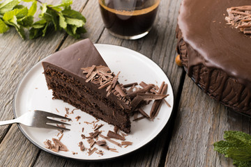 chocolate cake on wood background.