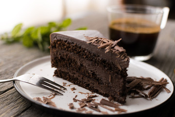 chocolate cake on wood background.