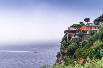 hotel on the edge of the mountain, with a view to the sea Rain clouds over beautiful Sorrento, Meta Bay in Italy, travel and vacation concept, copy space, Europe