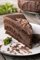 chocolate cake on wood background.