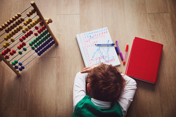 little boy tired stressed of doing homework