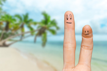 Human hand fingers with funny painted emoticons. People relationships concept