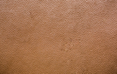 Abstract light brown texture. Ribbed fabrics leather background.