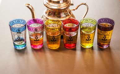 arabic teapot with colorful glasses