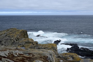 view from the top of a cliff  across the ocean on the North Eastern shore of the Avalon region, Newfoundland Canada 
