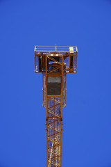 Naklejka premium Yellow construction crane isolated 