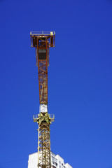 Obraz premium Yellow construction crane isolated 