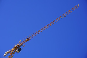 Yellow construction crane isolated 