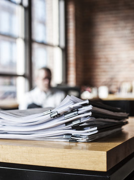 Close-up of files and file folders on a desk top in an office.