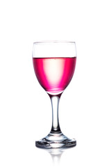 Red water on glass isolated on white background. Clipping path