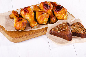 Fried chicken leg with grain bread, family dinner
