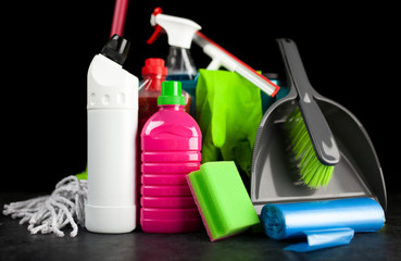 Cleaning supplies on black background