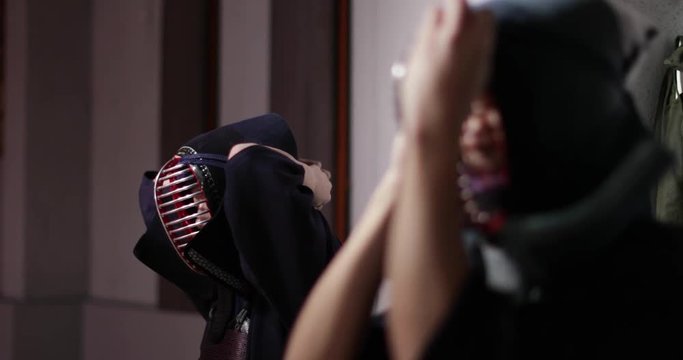 Kendo practitioners getting ready for fight in Dojo, Tokyo, Japan.