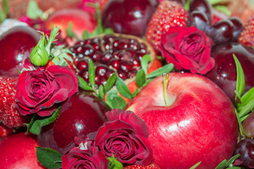 Bright red beautiful bouquet of fruits and flowers