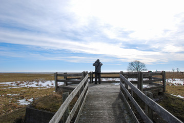 Obraz premium Birdwatcher by the famous birdwatching site Ottenby in Sweden