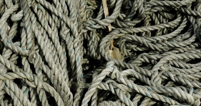 Closeup of ship rope or nautical rope with knots to tied a ship at the port. Shot in 4k resolution