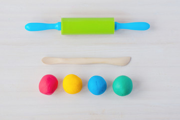 Fototapeta premium Multicolored plasticine modeling tools. Top view.