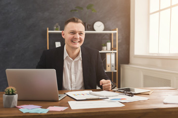 Serious man office worker is reading report