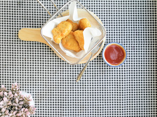 fried nuggets in in a frying pan on the table