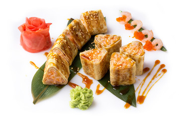 Sushi roll turned on a white background. Sushi Japanese food in a restaurant. Japanese restaurant menu. Roll in an omelette isolated on white background.