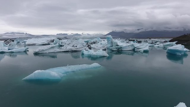 Gigantic icebergs in front of a huge glacier - Iceland