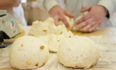 Preparing dough in a bakery.