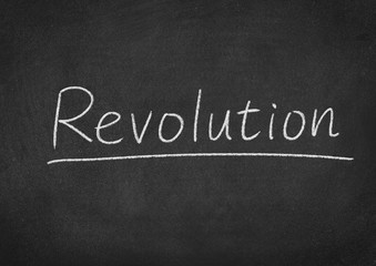revolution concept word on a blackboard background