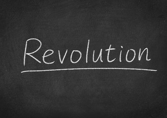 Obraz premium revolution concept word on a blackboard background