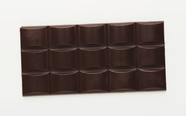 Bar of dark chocolate isolated on white