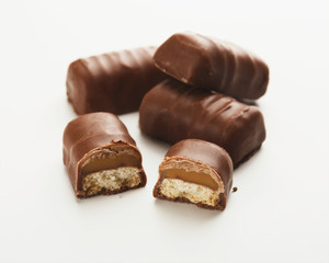 Small chocolate candies isolated on white