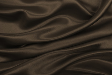 Smooth elegant brown silk or satin texture as abstract background. Luxurious background design. In Sepia toned. Retro style