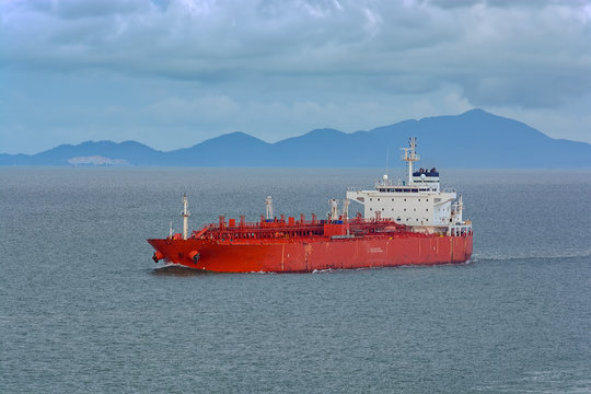 Oil/Chemical tanker under cloudy sky.
