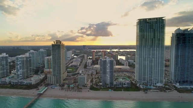Aerial reveal pull back drone footage Sunny Isles Beach FL
