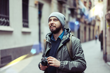 Male tourist with retro camera