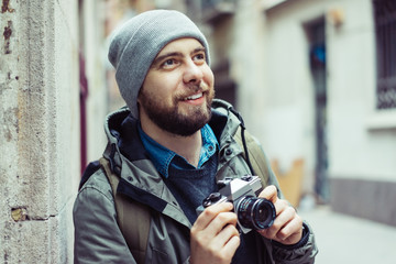 Male tourist with retro camera