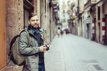 Male tourist with retro camera