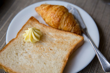 Toast bread with butter and croissant