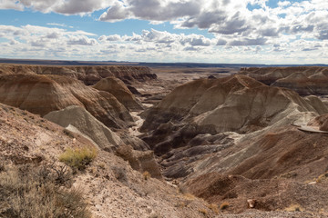 Fototapeta na wymiar Painted Desert at Petrified Forest National Park with cloudy skies in background