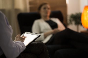 Close-up of counselor using tablet