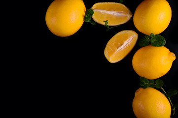 Lemons isolated on the black background. Top view