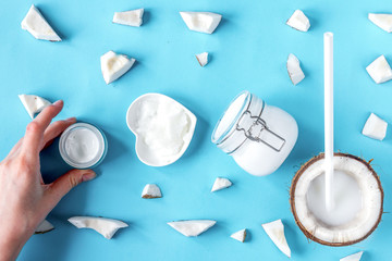 concept organic cosmetics with coconut on blue background top vi