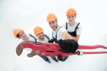 view from the top.group of builders showing a gas key.
